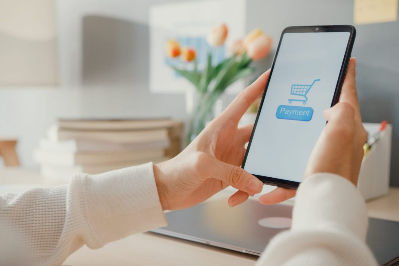 Young asia lady use cellphone order online shopping product and Young asia lady use cellphone order online shopping product and paying bills with banking app with transaction successful. Stay at house, Quarantine activity, Fun activity for coronavirus prevention.